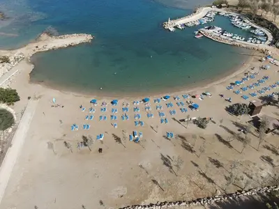 an aerial view of a beach with umbrellas and chairs at Trinity Getaway in Paralimni