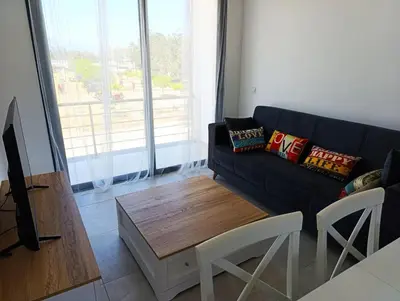 a living room with a couch and a coffee table at LJ Park Penthouse North Cyprus