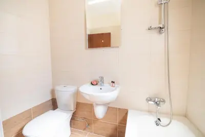 a bathroom with a toilet and a sink and a shower at Malama 2 Villa Ekaterina 2 bedroom in Paralimni
