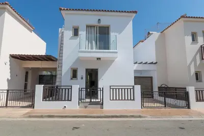 a white house with balconies on a street at Malama 2 Villa Ekaterina 2 bedroom in Paralimni