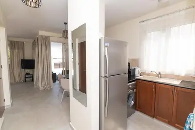 a kitchen with a stainless steel refrigerator in a kitchen at Malama 2 Villa Ekaterina 2 bedroom in Paralimni
