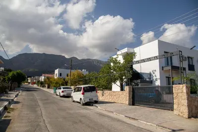 a white car parked on the side of a street at Apartment Northern Cyprus