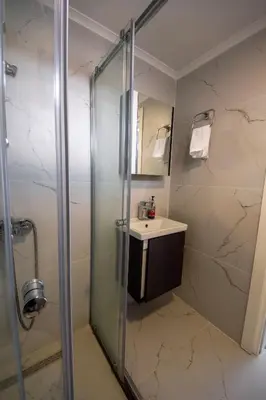 a bathroom with a shower and a sink at Apartment Northern Cyprus