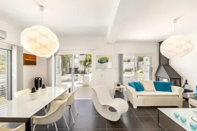 a living room with white furniture and a table at Protaras Seaside Villa Narcissos 16 in Protaras