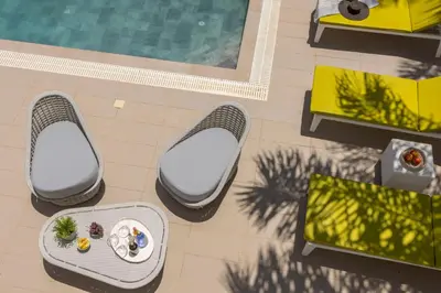 an overhead view of a patio with tables and a pool at Protaras Seaside Villa Narcissos 16 in Protaras