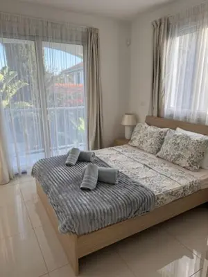 a bedroom with a large bed with pillows on it at Villa Samantha in Paralimni