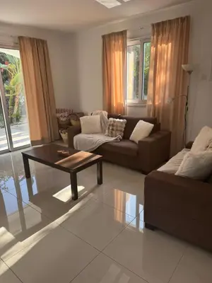 a living room with a couch and a coffee table at Villa Samantha in Paralimni