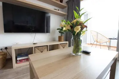 a vase of flowers on a table in a living room at Central 1BR - Views - Deli Café in Nicosia