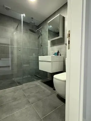 a bathroom with a toilet and a sink and a shower at Marimar2 paradise by the Sea in Larnaka