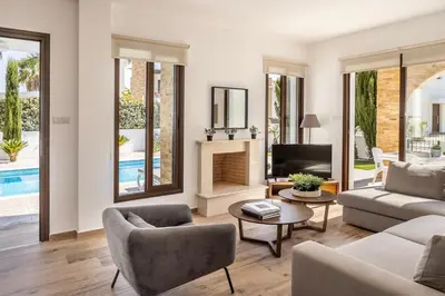 a living room with a couch and a fireplace at Ionion H30 in Ayia Napa