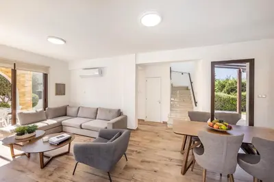 a living room with a couch and a table at Ionion H30 in Ayia Napa
