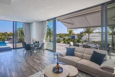 a living room with a couch and a table at Villa Almaria ALM28 in Protaras
