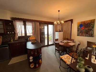 a kitchen and dining room with a table and a dining room at Αετοφωλιά-AETOFOLIA in Pano Lefkara