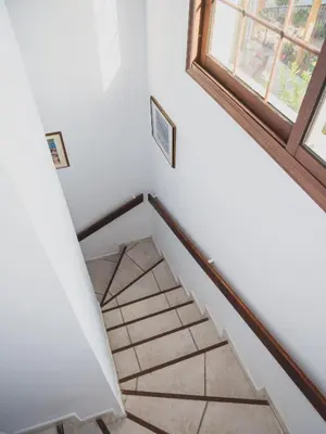 a staircase in a house with a window at Revecca House in Ayios Mamas