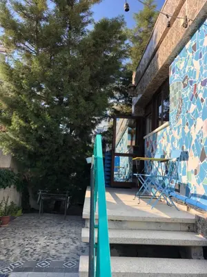 a couple of surfboards sitting on the steps of a building at Lemongrass Hostel in Limassol