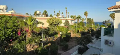 an aerial view of a resort with trees and plants at Barefoot Beach House in Larnaka
