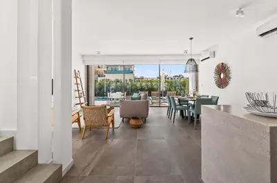 a kitchen and dining room with a table and chairs at Azure Leda Villa in Protaras