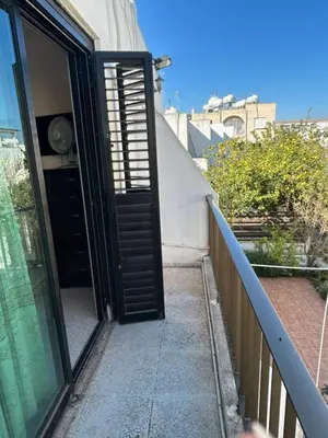 an open door on a balcony of a building at Two Floor Maisonette by the Sea in Protaras