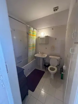 a small bathroom with a toilet and a sink at Two Floor Maisonette by the Sea in Protaras
