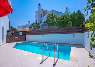 a swimming pool in the backyard of a house at Anemone Seaview Villa DPS01 in Protaras