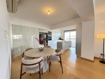 a kitchen and dining room with a table and chairs at Home in Central Nicosia - Spacious Balcony in Nicosia