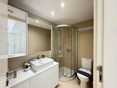 a bathroom with a sink and a shower and a toilet at Home in Central Nicosia - Spacious Balcony in Nicosia