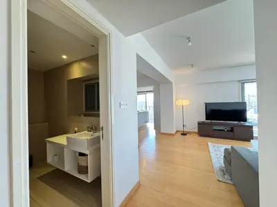 a bathroom with a sink and a television in a room at Home in Central Nicosia - Spacious Balcony in Nicosia