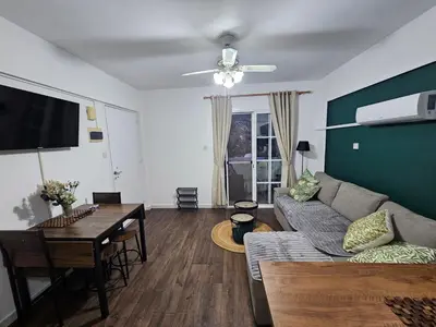 a living room with a couch and a table at D&D Apartment in Paralimni