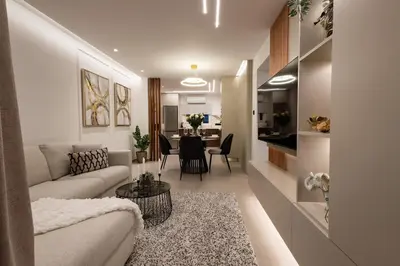 a living room with a couch and a dining room at Luxury Marina Beach Stay in Limassol
