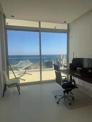 an office with a desk and chairs and a large window at Stunning Penthouse with Sea and City View in Larnaka