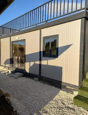 a house with two windows on the side of it at Anastasi Tiny Homes- Mountain Views, Garden & Terrace, Pet Friendly in Kakopetria