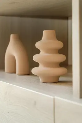 two vases sitting on top of a shelf at 1 bedroom flat next to university in Aglantzia