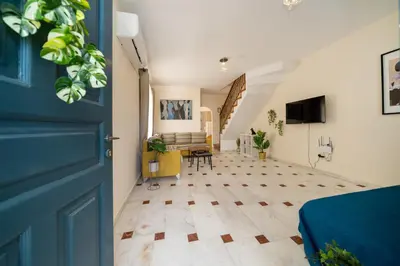 a room with a blue door and a living room at 2 bedroom house near the beach in Limassol
