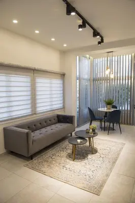 a living room with a couch and a table at STAY Glam Skin Studio in Nicosia