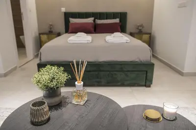 a bedroom with a bed and a table with a table sidx sidx sidx at STAY Glam Skin Studio in Nicosia