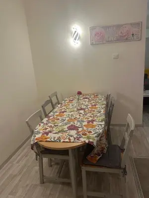 a table with a quilt on it in a room at Near Finikoudes Beach 15 in Larnaka