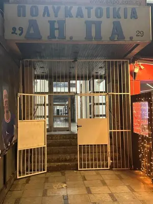 an entrance to a building with a gate in front at Near Finikoudes Beach 15 in Larnaka