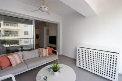 a living room with a couch and a table at Modern City Retreat - Balcony and Chic Design in Nicosia