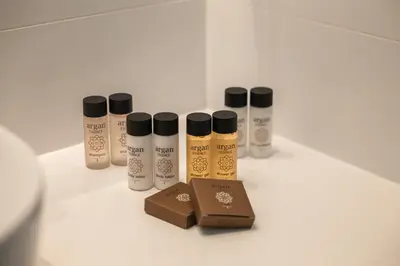 a group of four bottles of hair products on a counter at Warner Boutique Hotel-Adults Only in Larnaka