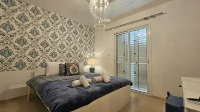 a bedroom with a bed with two pillows at STAY Alex's House in Strovolos