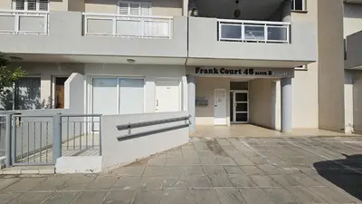 a building with the front entrance to the front yard of a building at STAY Alex's House in Strovolos