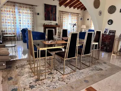 a dining room with a table and chairs at Charming Erimi Villa with Private Pool and Garden View in Erimi