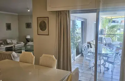 a dining room and living room with a table and chairs at STAY Charm Classic Apartment in Strovolos