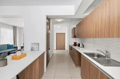 a kitchen with a sink and a counter top at Downtown Sea View Penthouse in Larnaka