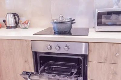 a pot sitting on top of a stove in a kitchen at Finikoudes gate in Larnaka