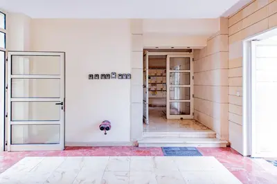 an empty room with a door in a building at Finikoudes gate in Larnaka