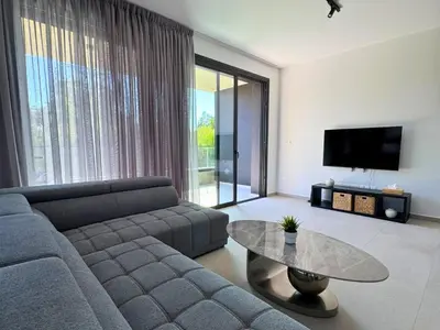 a living room with a couch and a table at Hypnos Park View in Nicosia