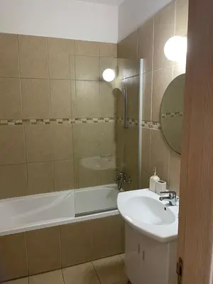 a bathroom with a sink and a tub and a shower at Casa Luna in Paralimni