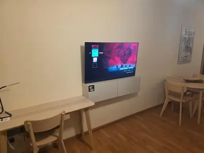 a flat screen tv on a wall in a living room at Alasia Apt-2Bdr in Nicosia