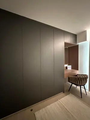 a room with a large wall of gray cabinets at Idei-Eos Charming & Comfort Apartment in Nicosia